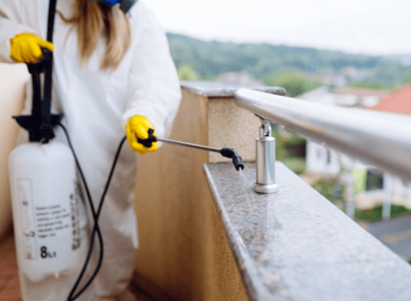 restaurant-mid-1 A pest control technician spraying a balcony