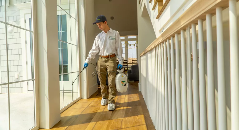 GPM_Tech_Shoot_Zach_2022-03719_Extended Green Pest Management pest control technician performing an interior pest control service